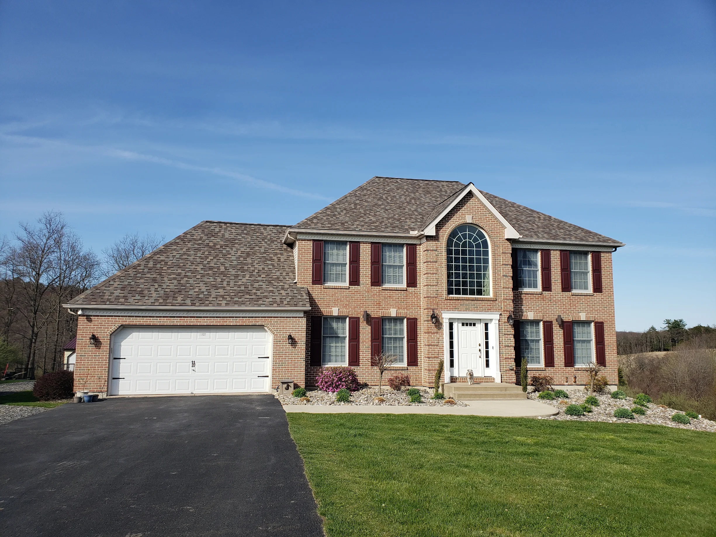 A Large Residential Suburban Home with a New Shingle Roof