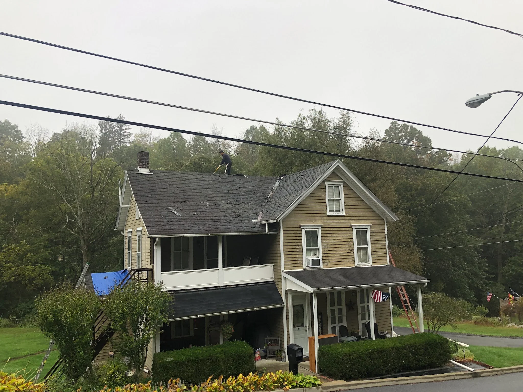 A Roofer Removes Shingles from Lehigh Valley Residence