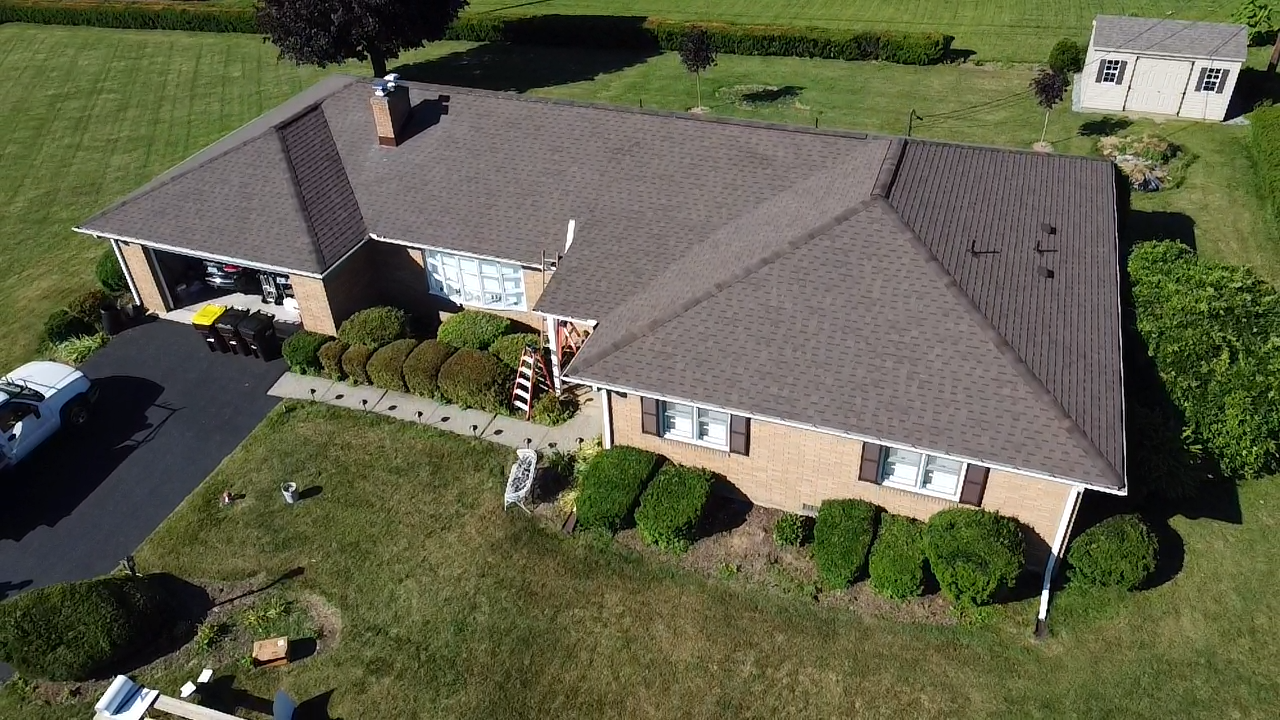 Aerial View of a New Brown Shingle Roof on a Brick Ranch Home